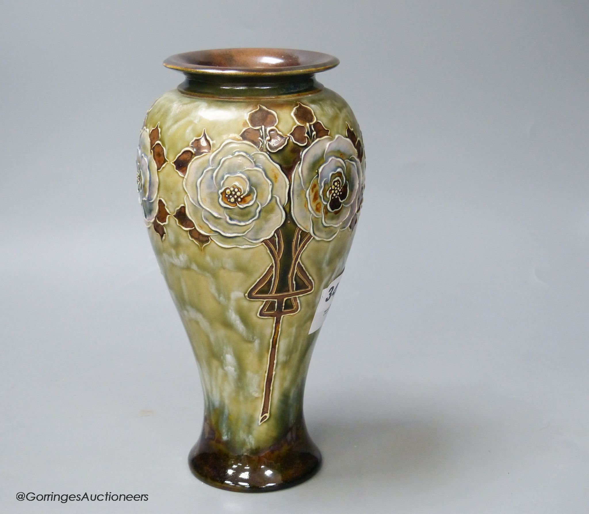 A Royal Doulton stoneware vase decorated with white roses by Eliza Simmance